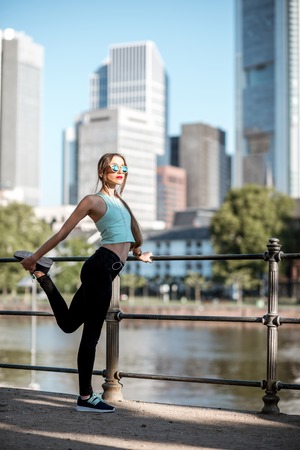 Woman exercising in Frankfurt cityの写真素材