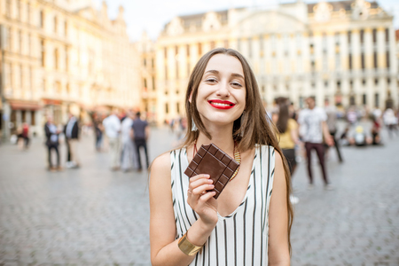 Woman with chocolate outdoors in Brusselsの写真素材