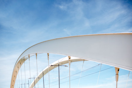 Modern bridge on the sky background