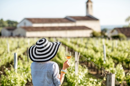 Woman tasting wine outdoorsの写真素材