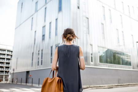 Businesswoman outdoors at the modern office districtの写真素材