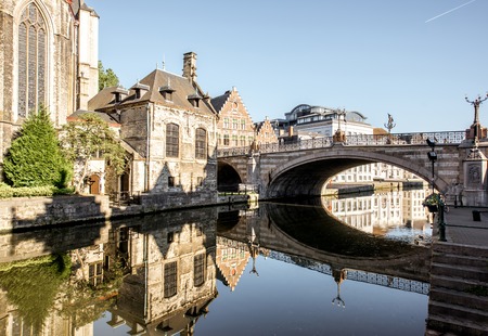 Morning view on the saint Nicholas bridge and church in Gent city, Belgiumの写真素材