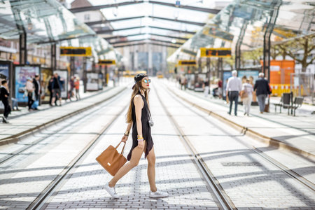 Woman at the city transport stop