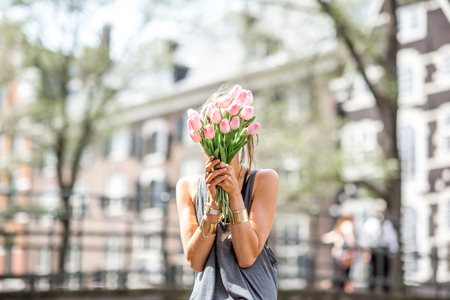 Woman with bicycle in Amsterdam cityの写真素材