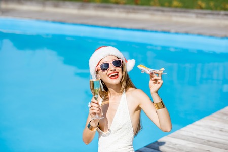 Woman in xmas hat at the swimming poolの写真素材