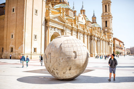 ZARAGOZA, SPAIN - August 20, 2017: View on the cathedral of Our Lady of the Pillar with Earth monument on the central square in Zaragoza city, Spainのeditorial素材