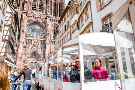 STRASBOURG, FRANCE - July 26, 2017: View on the crowded street with beautiful old buildings and Notre-Dame cathedral in Strasbourg city, Franceのeditorial素材