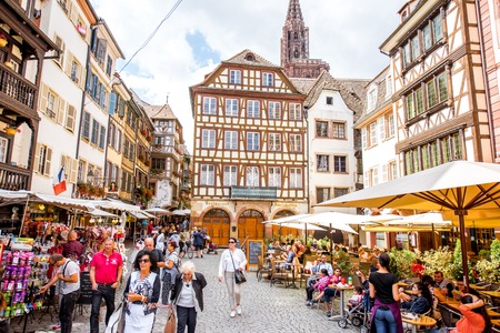 STRASBOURG, FRANCE - July 26, 2017: View on the beautiful square with people sitting at the cafes and restaurants in Strasbourg old town, Franceのeditorial素材