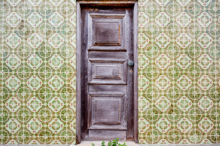 Facade view on the beautiful house wall with beautiful portuguese tiles for backgroundの写真素材