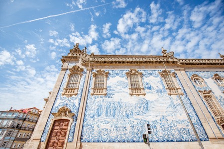Facade view on the church wall with famous poruguese blue tiles Azulejo in Porto city in Portugalの写真素材