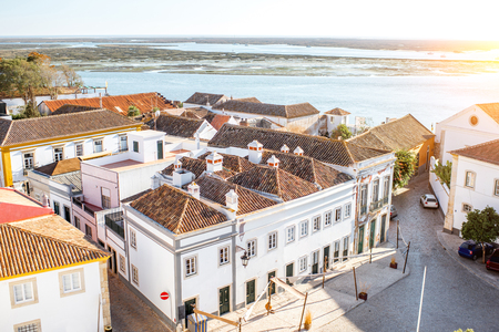 Top cityscape view on the old town with beautiful rooftops in Faro on the south of Portugalの写真素材