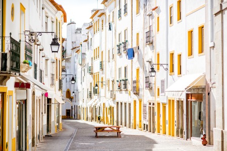 Street view with beautiful old residential buildings in Evora city in Portugalの写真素材