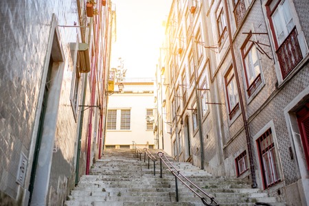 Beautiful street view with beautiful residential buildings in Mouraria district during the morning light in Lisbon city, Portugalの写真素材