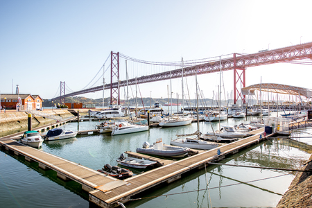 LISBON, PORTUGAL - September 28, 2017: View on the harbor with luxury yachts and 25th of april bridge in Lisbon city, Portugalのeditorial素材