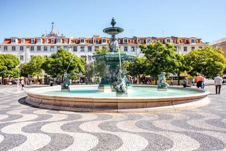LISBON, PORTUGAL - September 27, 2017: Beautiful view on the fountain on the Rossio square with column during the sunny day in Lisbon city, Portugalのeditorial素材