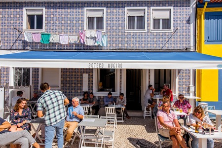 AVEIRO, PORTUGAL - September 26, 2017: View on the crowded street with cafe and bars in the old town of Aveiro, Portugalのeditorial素材