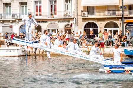 SETE, FRANCE - July 30, 2017: Water jousting competition which lasted in Sete on the south of France. Jousting is a fight on the boat practised principally in Franceのeditorial素材