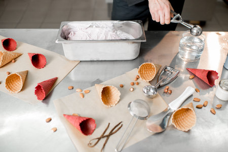 Food ingredients and professional tools for ice cream production on the table indoors
