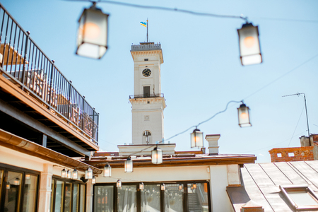 View on the city hall tower with beautiful terrace and lanterns in Lviv city in Ukraineの写真素材