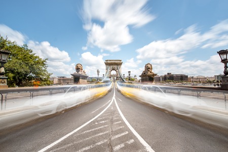 Road view on the Chain bridge with motion blurred cars during the daylight in Budapest, Hungary. Long exposure image technicの写真素材