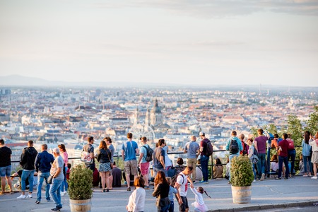 HUNGARY, BUDAPEST - MAY 20, 2018: Tourists enjoying great view on Budapest city standing on the Gellert hill viewpoint during the sunsetのeditorial素材