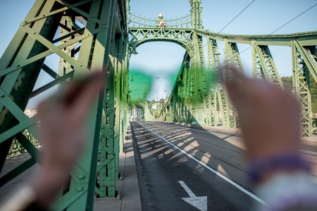 Looking through the green sunglasses on the Liberty bridge in Budapest, Hungaryの写真素材