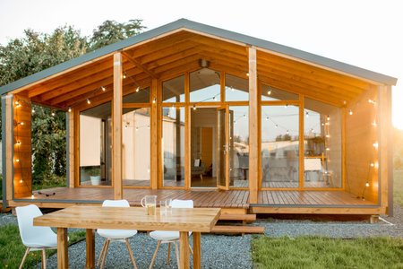 Beautiful backyard of the wooden country house with table for dining