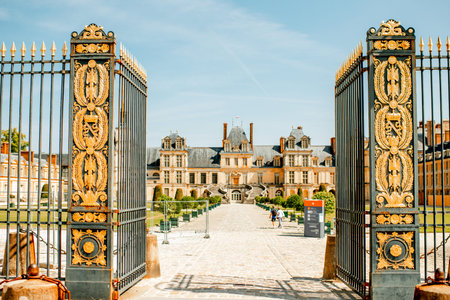 FONTAINBLEAU, FRANCE - August 28, 2017: View on the golden gates and famous palace of Fontainebleau located on the southeast of Paris in Franceのeditorial素材
