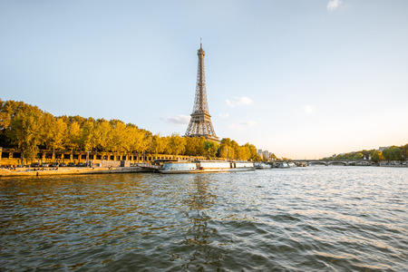 View on the Eiffel tower from the boat during the sunset in Parisの写真素材