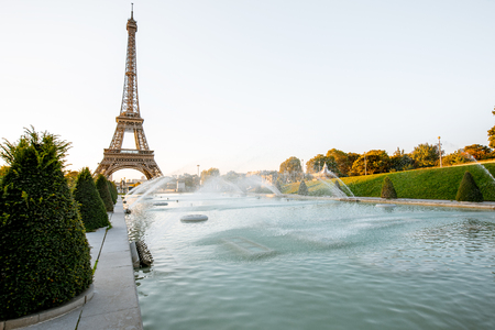 Landscape view of the Eiffel tower with fountains during the sunrise in Parisの写真素材