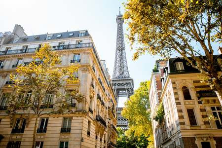 Beautiful street view with old residential buildings and Eiffel tower during the daylight in Parisの写真素材