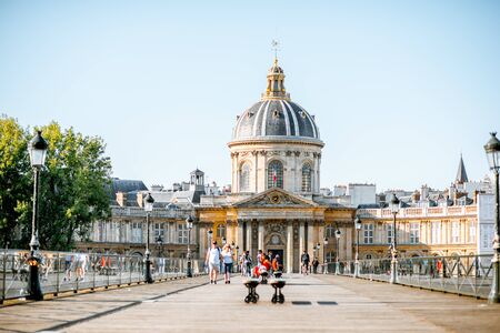 PARIS, FRANCE - September 01, 2018: View on the Institute of France building with people walking on Concordia bridge in Parisのeditorial素材