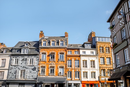 Beautiful facades of the old buildings in the central square in Honfleur, famous french town in Normandyの写真素材
