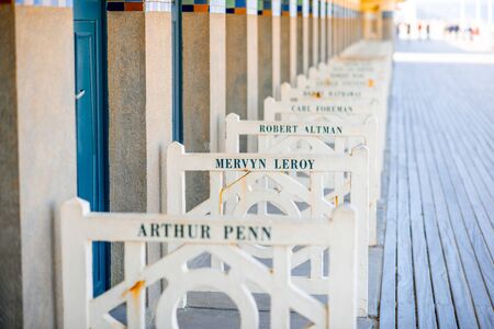 DEAUVILLE, FRANCE - September 06, 2017: Famous locker rooms on Planches promenade dedicated to Mervyn Leroy, actors and movie makers who participated in Film Festival of Deauvilleのeditorial素材