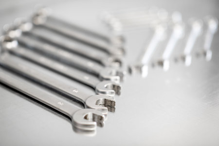 Pile of a new car wrenches on the stainless table