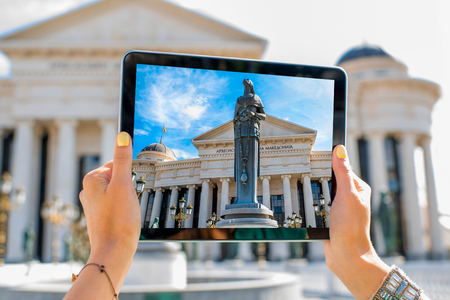 Woman photographing with digital tablet Maria Teresa monument in Skopjeのeditorial素材