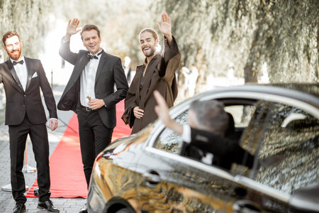 Movie actors gathering together on the red carpet before awards ceremony or movie premiere, man...