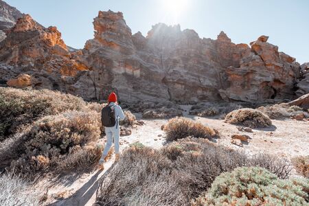 Landscape of a beautiful rocks on the desert valley with woman traveling at the natural park near Teide volcano on Tenerife island, Spainの写真素材
