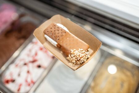 Chocolate ice cream on the carboard at the shop, close-upの写真素材