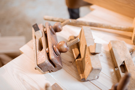 Vintage planes on the workbench in the carpentry shopの写真素材