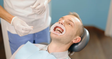 Patient with dental braces during a regular orthodontic visit