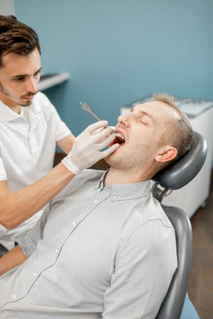 Dentist and patient during an orthodontic treatmentの写真素材