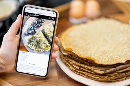 Smart phone with recipe of yummy pancakes