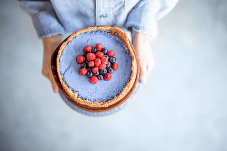 Woman with berry cheesecakeの写真素材