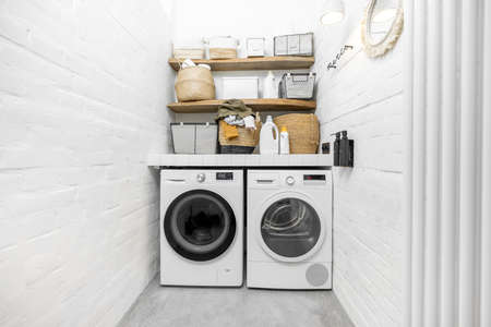 Domestic laundry room in white tonesの写真素材