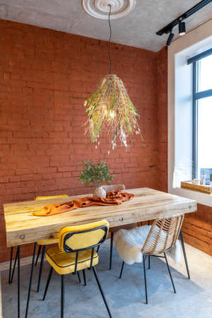 Dining place with a wooden tableの写真素材