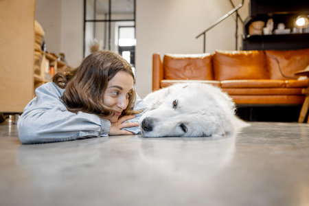 Happy woman with a dog at home