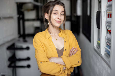 A portrait of young housewife in the boiler room at homeの写真素材