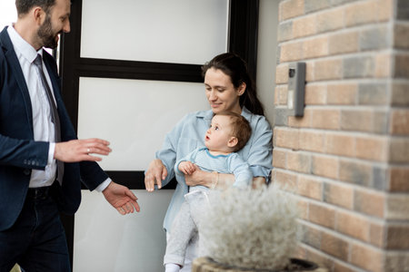 Caucasian father waving goodbye to his family