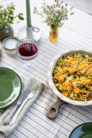 Table in the garden is covered with a tableclothの写真素材